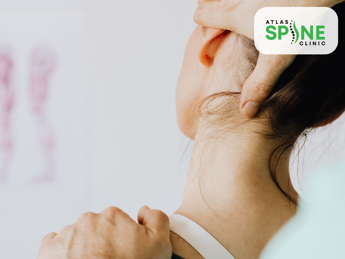 Chiropractor assessing a patient neck during a first chiropractic visit in Scarborough