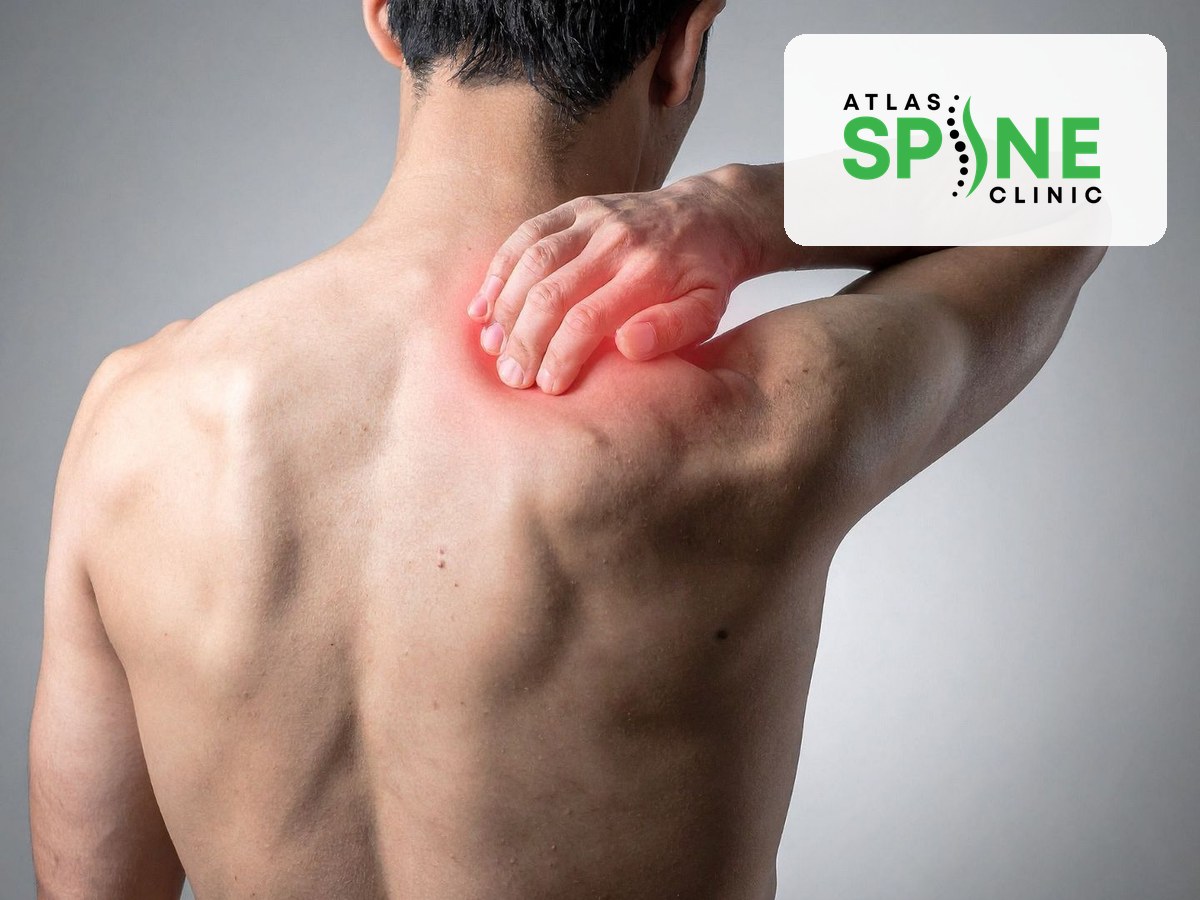 Person holding a stiff, painful shoulder, a common early sign of frozen shoulder, Atlas Spine Clinic Scarborough
