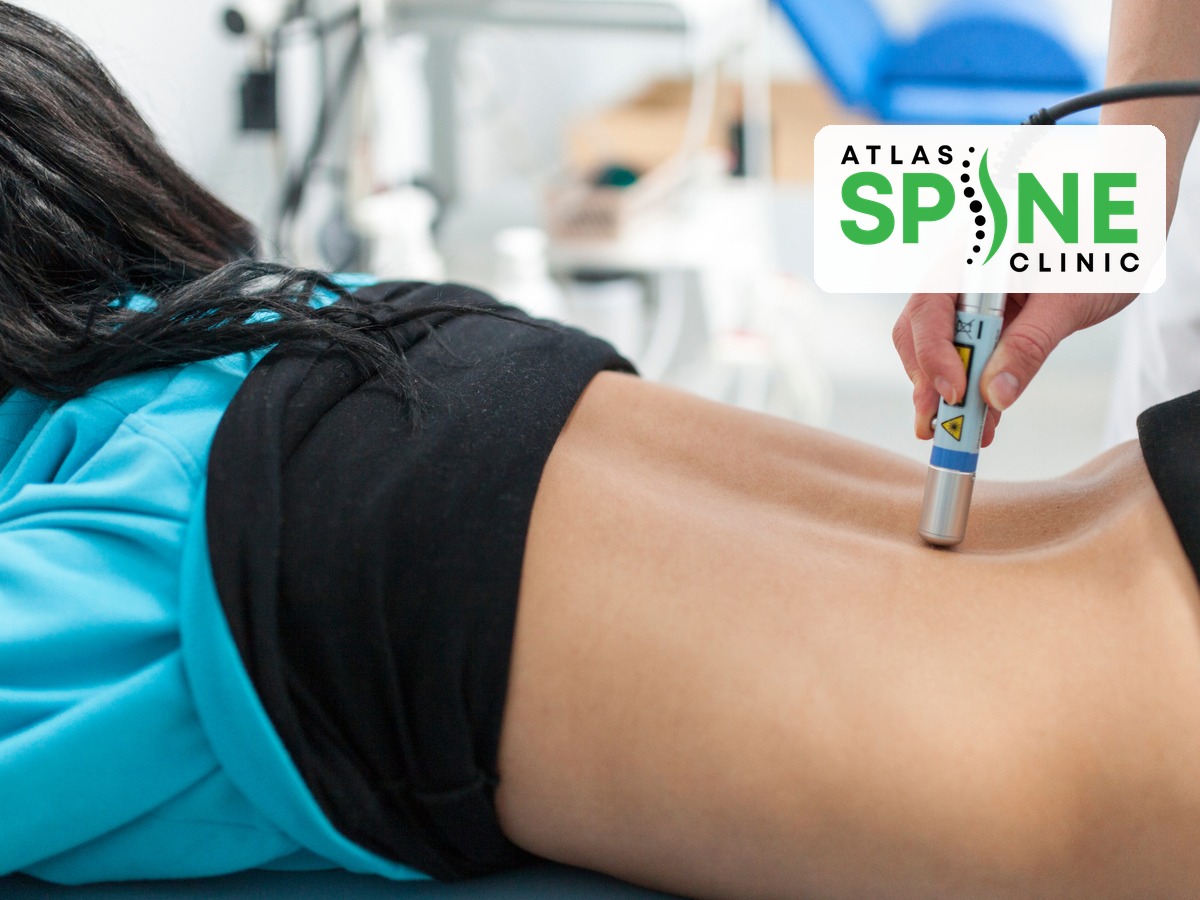 Laser therapy applied to a patient’s lower back at Atlas Spine Clinic in Scarborough