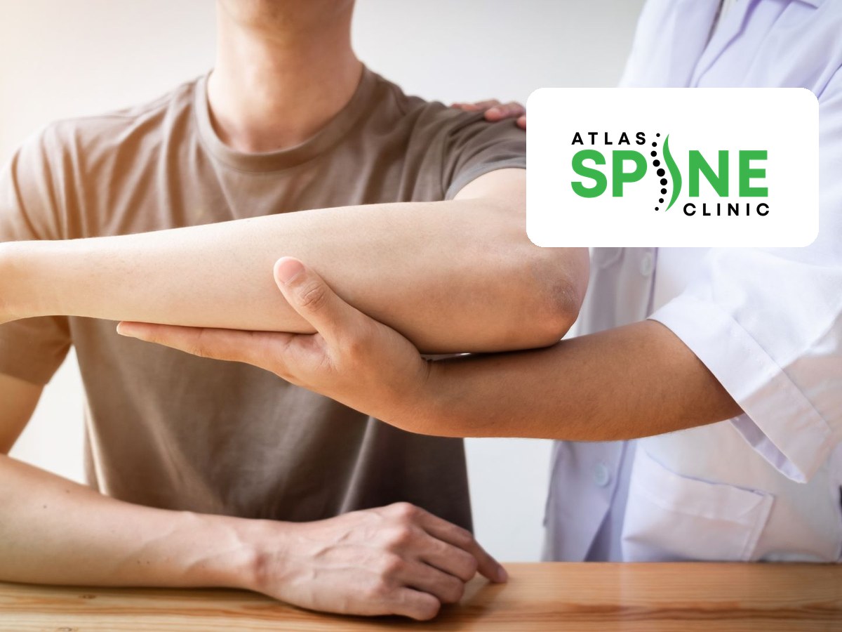 Physiotherapist performing a hands-on shoulder assessment at Atlas Spine Clinic in Scarborough