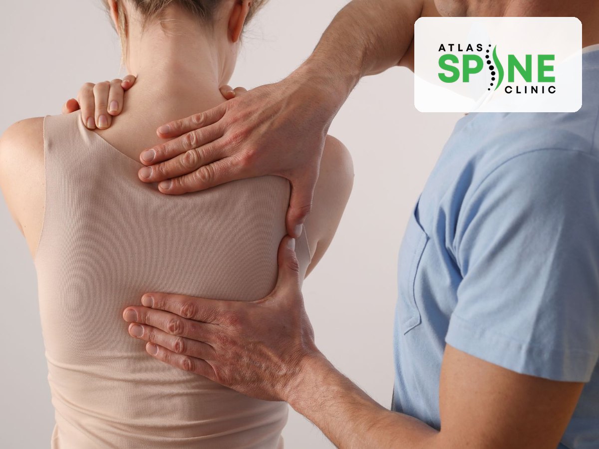 Chiropractor assessing a patient's spine and posture for scoliosis at Atlas Spine Clinic in Scarborough