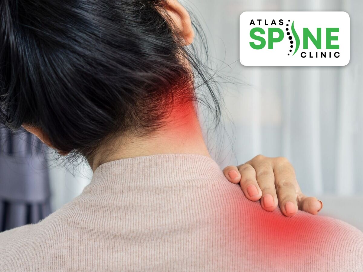 Woman holding her neck and shoulder from neck pain, Atlas Spine Clinic Scarborough