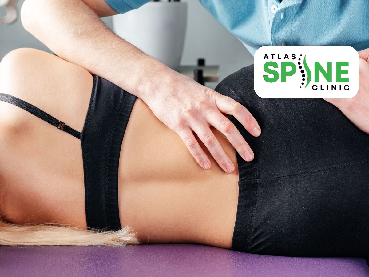 Hands-on low back and sacroiliac joint assessment at Atlas Spine Clinic in Scarborough